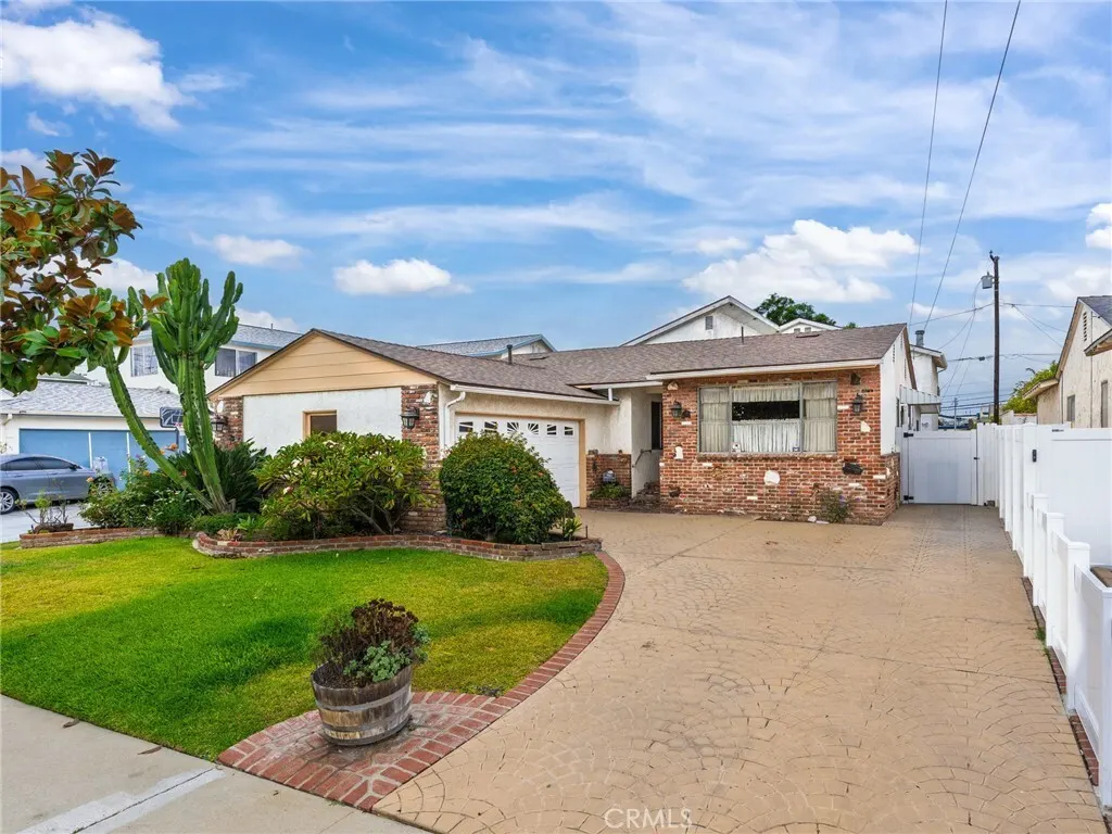 Single story home with a front lawn at 18325 Patronella Avenue, Torrance